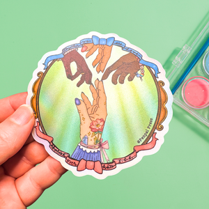 Colorful sticker of hands reaching out to a hand with tattoos on a green background.