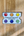 Penpal Press watercolor rainbow palette on a wooden surface