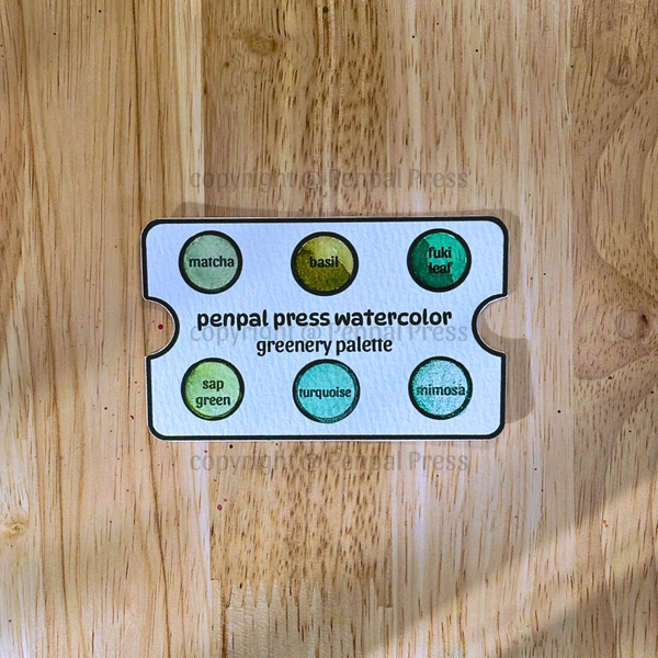 Penpal Press watercolor greenery palette on a wooden surface