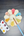 Colorful paint palette with a brush on a gray surface