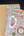 Notebook with stickers and a pen on a dark surface
