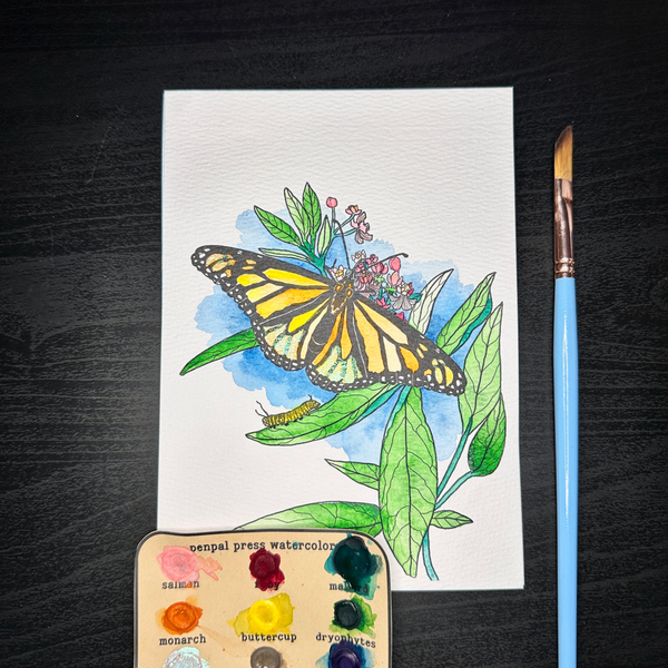 Painting of a  monarch butterfly and leaves on paper with a paintbrush and color swatch.