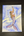Colorful painting of a mermaid on a wooden surface