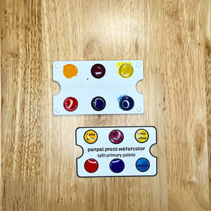 penpal press watercolor split primary palette on a wooden surface