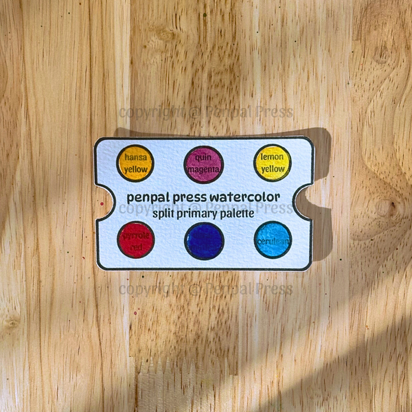 Penpal Press watercolor split primary palette on a wooden surface