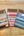 Three packages of Penpal Press washi tape samples on a wooden surface