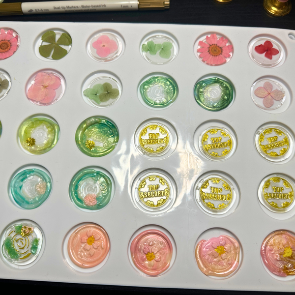 Set of decorative round stickers with floral designs on a white background